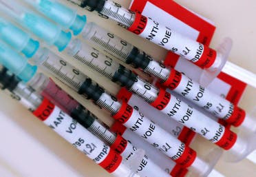 Syringes with the Biontech/Pfizer vaccine against COVID-19 disease are ready at the vaccination center of the Dron hospital in Tourcoing, northern France. (AP)
