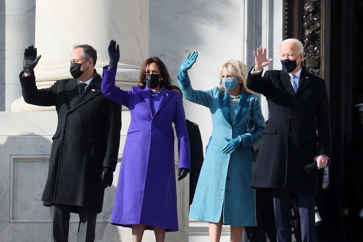 Vice President-elect Kamala Harris and President-elect Joe Biden with their spouses wave as they arrive at the Capitol for the inauguration on January 20, 2021. (AFP)