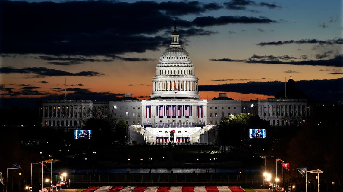 Capitol Building and stage for the swearing-in is lit as events get underway for President-elect Joe Biden's inauguration ceremony, Wednesday, Jan. 20, 2021, in Washington. (AP)