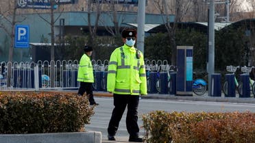 Police guard a blocked-off street in a residential neighbourhood following new cases of the coronavirus disease (COVID-19) in Tiangongyuan area of Daxing district in Beijing, China. (Reuters)