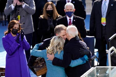 President Joe Biden hugs first lady Jill Biden, his son Hunter Biden and daughter Ashley Biden after being sworn-in, Jan. 20, 2021. Vice President Kamala Harris applauds at left. (AP)