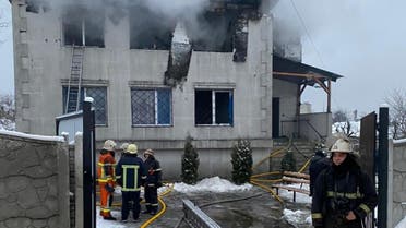 Firefighters work at the site of a fire in a nursing home in Kharkiv on January 21, 2021. (AFP)