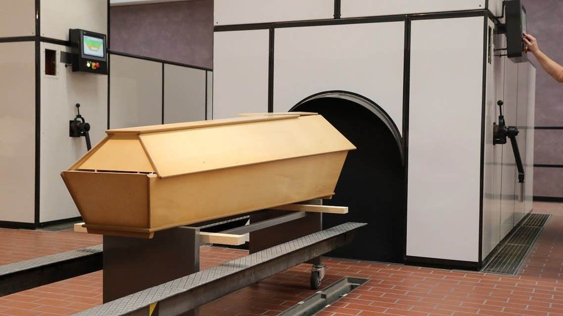 202A coffin of a person who passed away stands in the furnace hall at the Crematorium Nordheim as the coronavirus outbreak continues in Zurich, Switzerland, on January 19, 2021. (Reuters)1-01-21T093046Z_1062203389_RC29CL9S058M_RTRMADP_3_HEALTH-CORONAVIRUS-SWISS-CREMATORIUM