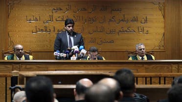 Egyptian judge Mohamed Shirin Fahmi (C) reads out a verdict and sentence as he presides over the retrial of members of the Muslim Brotherhood on charges of espionage with the Palestinian group Hamas at the Tora courthouse complex in southeastern Cairo on September 11, 2019. (AFP)