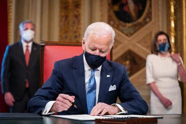 President Joe Biden signs three documents including an Inauguration declaration, cabinet nominations and sub-cabinet nominations in the Presidents Room at the Capitol, Jan. 20, 2021. (Reuters)