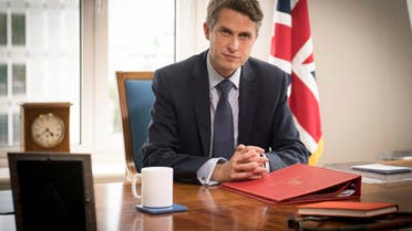 Britain's Secretary of State for Education Gavin Williamson poses for a photo in his office at the Department of Education in London. (AP)