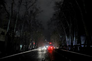 Cars drive on an unlit street during a blackout in Tehran, Iran, Wednesday, Jan 20, 2021. (AP)