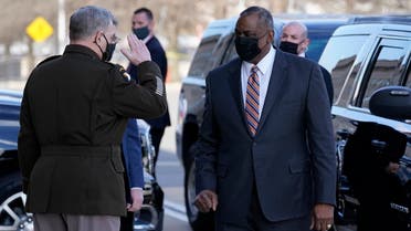 Defense Secretary Lloyd Austin, right, is saluted by Chairman of the Joint Chiefs of Staff Mark Milley as he arrives at the Pentagon, Jan. 22, 2021. (AP)