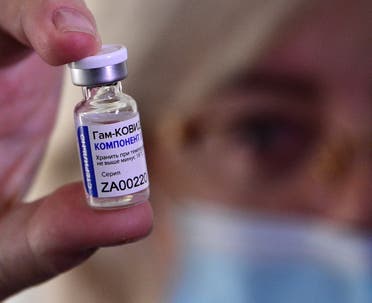 A medical worker shows a vial with Sputnik V (Gam-COVID-Vac) vaccine against the coronavirus disease during the vaccination of medics at a clinic in the far eastern city of Vladivostok. (File photo: AFP)
