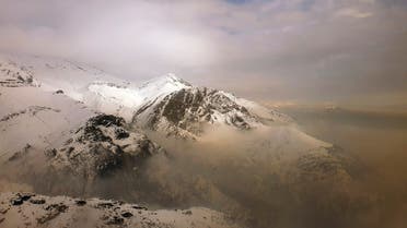 Air pollution blankets a mountain range in Tehran, Iran. (AP)