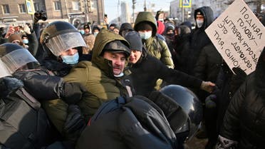 Law enforcement officers restrain a protester during a rally in support of jailed Russian opposition leader Alexei Navalny in Omsk, Russia January 23, 2021. (Reuters)