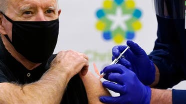 President-elect Joe Biden receives his second dose of the coronavirus vaccine at ChristianaCare Christiana Hospital in Newark, Del., Monday, Jan. 11, 2021. The vaccine is being administered by Chief Nurse Executive Ric Cuming. (AP Photo/Susan Walsh)