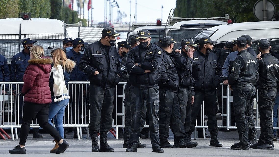 Members of the Tunisian police block the Habib Bourguiba Avenue during an anti-government demonstration in the capital Tunis, on January 23, 2021. (Fethi Belaid/AFP)