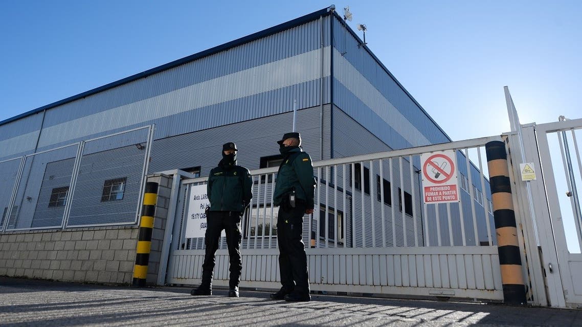 Civil guards watch the entrance of a warehouse in Cabanillas del Campo, Guadalajara province, where the first batch of the Pfizer-BioNTech vaccine is stored after arriving from Belgium, December 26, 2020. (Oscar Del Pozo/AFP)