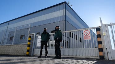 Civil guards watch the entrance of a warehouse in Cabanillas del Campo, Guadalajara province, where the first batch of the Pfizer-BioNTech vaccine is stored after arriving from Belgium, December 26, 2020. (Oscar Del Pozo/AFP)