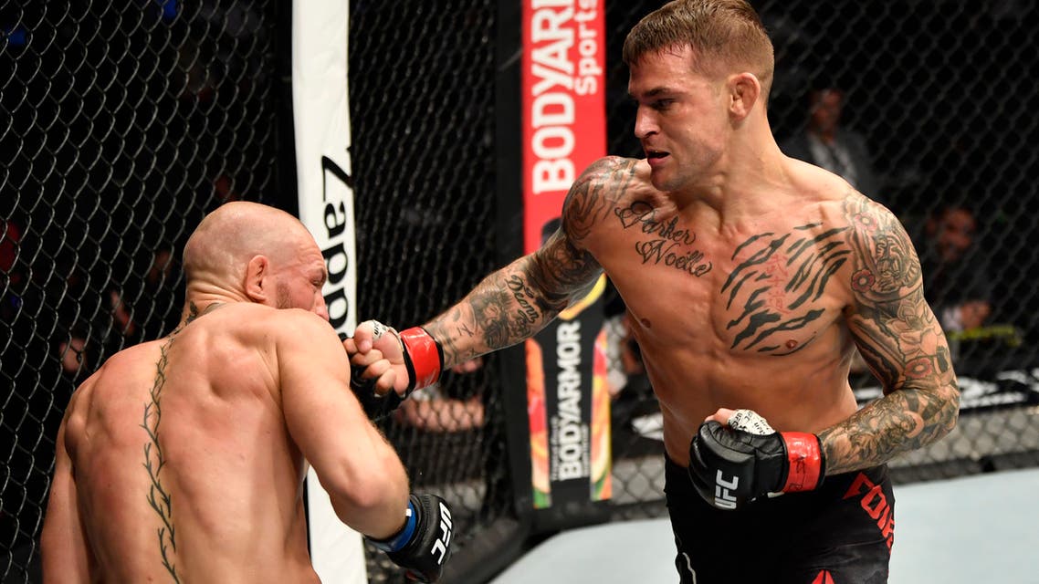 Dustin Poirier punches Conor McGregor of Ireland in a lightweight fight during the UFC 257 event inside Etihad Arena on UFC Fight Island. (Jeff Bottari/Handout Photo via USA TODAY Sports/Reuters)