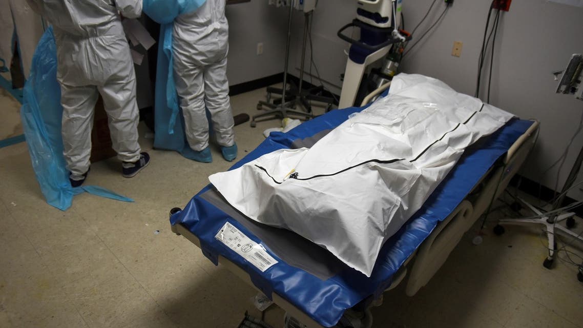 FILE PHOTO: A patient who died lays in a body bag inside a coronavirus disease (COVID-19) unit at United Memorial Medical Center as the United States nears 300,000 COVID-19 deaths, in Houston, Texas, U.S., December 12, 2020. REUTERS/Callaghan O'Hare/File Photo