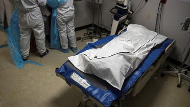 FILE PHOTO: A patient who died lays in a body bag inside a coronavirus disease (COVID-19) unit at United Memorial Medical Center as the United States nears 300,000 COVID-19 deaths, in Houston, Texas, U.S., December 12, 2020. REUTERS/Callaghan O'Hare/File Photo