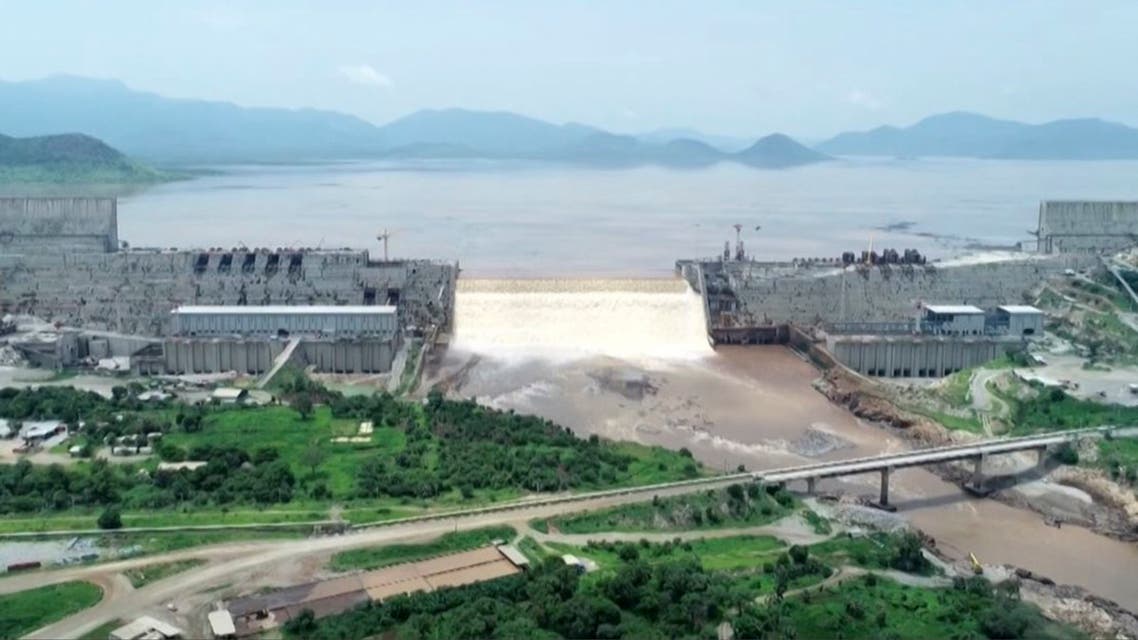 This frame grab from a video obtained from the Ethiopian Public Broadcaster (EBC) on July 20 and July 21, 2020 and released on July 24, 2020 shows water pouring out of the Renaissance Dam in Guba, Ethiopia, as Prime Minister Abiy Ahmed hails the historic early filling of the reservoir on the Blue Nile River that has stoked tensions with downstream neighbours Egypt and Sudan. 