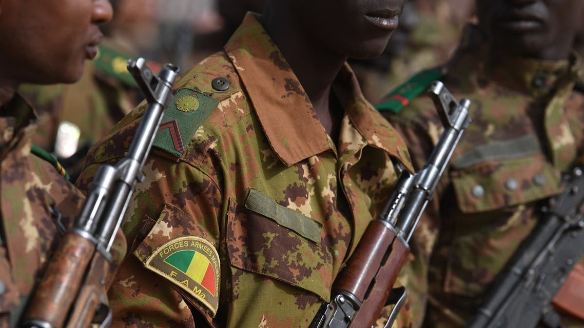 Malian troops stand guard prior to the visit of the French Prime Minister at the Operation Barkane military French base in Gao, Mali, on February 24, 2019.