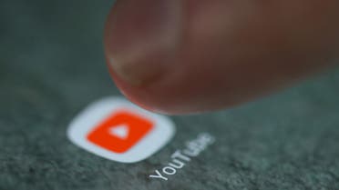 The YouTube app logo is seen on a smartphone in this picture illustration taken September 15, 2017. REUTERS/Dado Ruvic/Illustration