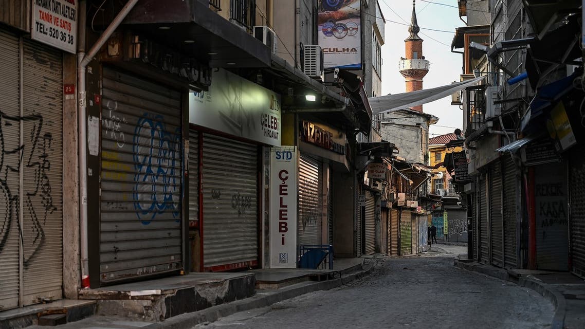 In this photo taken on December 6, 2020 a deserted street with shops closed can be seen near Eminonu square in Istanbul during a week-end curfew aimed at curbing the spread of the Covid-19 pandemic caused by the novel coronavirus. Under the new restrictions beginning from December 1, a curfew will be imposed on weekdays from 9:00 pm. to 5:00 am. Over the weekend the lockdown will last from 9:00 pm Friday until 5:00 am on Monday.