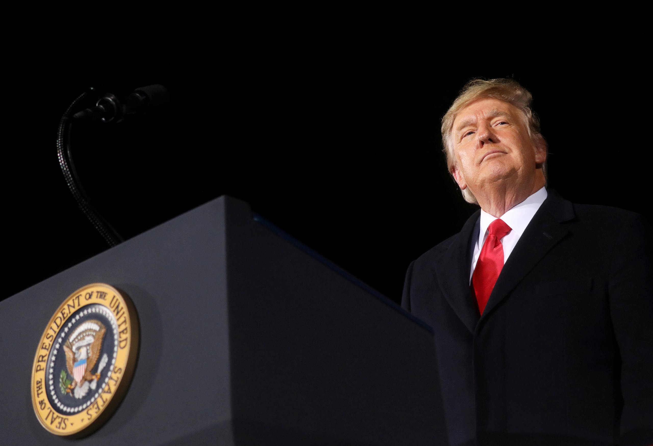 US President Donald Trump addresses a campaign rally in Dalton, Georgia, U.S., on the eve of the run-off election to decide both of Georgia's Senate seats January 4, 2021.(Reuters)