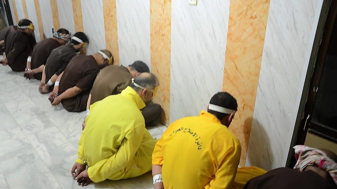This handout file picture released by the Iraqi Justice Ministry on June 29, 2018 shows blindfolded and handcuffed extremists of ISIS who have been condemned to death waiting for their sentences to be executed. (Iraq Justice Minister/AFP)