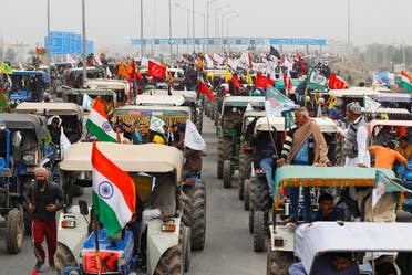 Farmers participate in a tractor rally to protest against the newly passed farm bills, on a highway on the outskirts of New Delhi, India, on January 7, 2021. (Reuters)