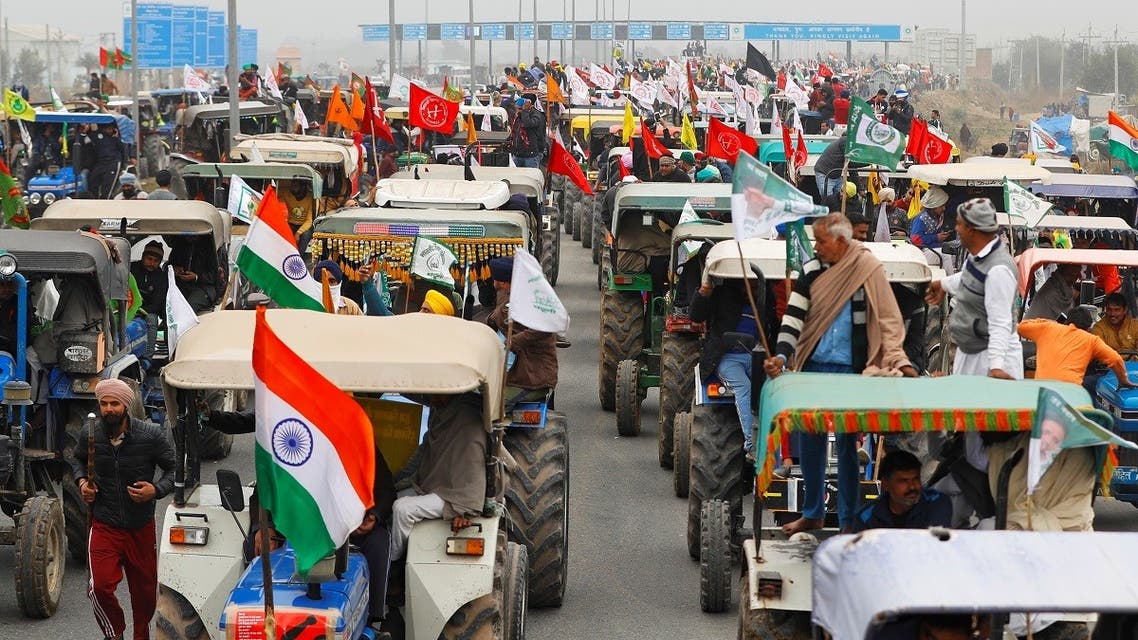 Farmers participate in a tractor rally to protest against the newly passed farm bills, on a highway on the outskirts of New Delhi, India, on January 7, 2021. (Reuters)