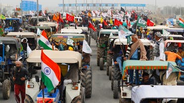 Farmers participate in a tractor rally to protest against the newly passed farm bills, on a highway on the outskirts of New Delhi, India, on January 7, 2021. (Reuters)