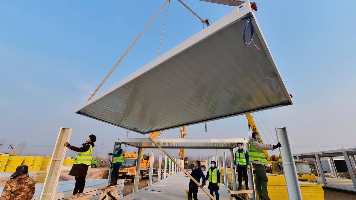 In this photo released by China's Xinhua News Agency, construction workers build a quarantine center which, according to state media, will have over 4,000 rooms to isolate close contacts of COVID-19 cases in Shijiazhuang in northern China's Hebei Province, Wednesday, Jan. 20, 2021.(AP)