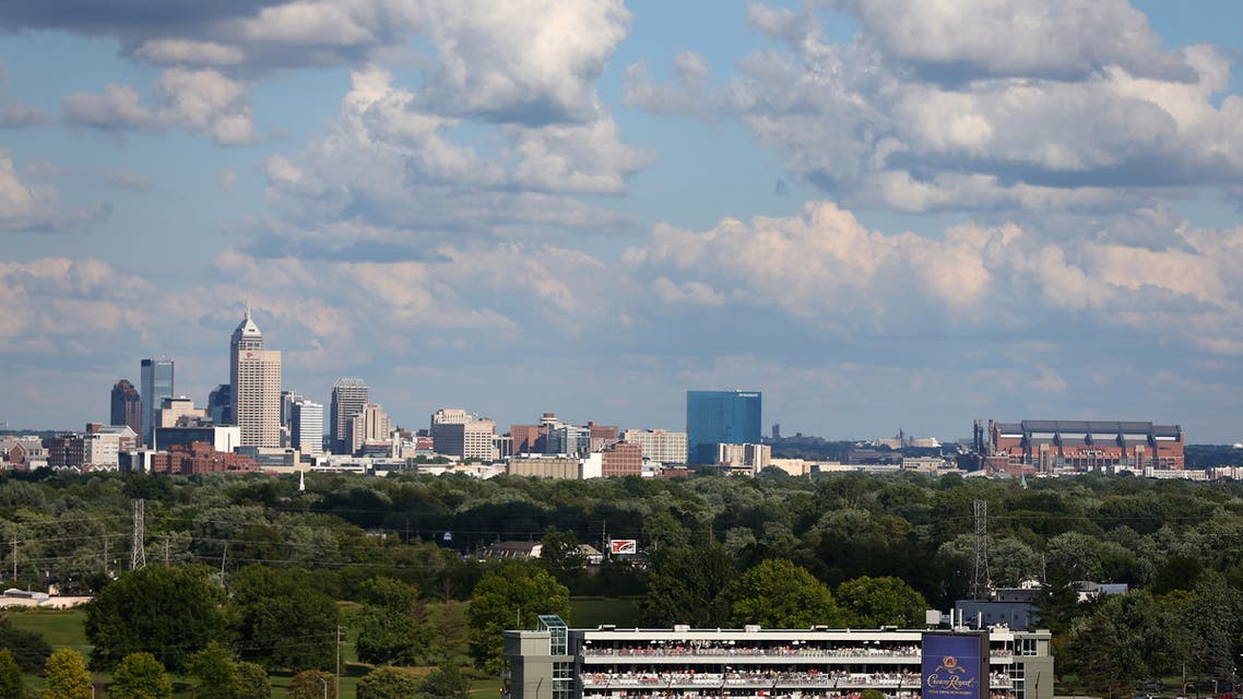 NDIANAPOLIS, IN - JULY 27: Cars race through turn two with the skyline of downtown Indianapolis during the NASCAR Nationwide Series Indiana 250 at Indianapolis Motor Speedway on July 27, 2013 in Indianapolis, Indiana. Chris Graythen/Getty Images/AFP Chris Graythen / GETTY IMAGES NORTH AMERICA / Getty Images via AFP