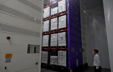 A man stands next to boxes containing the vials of AstraZeneca's COVISHIELD, coronavirus disease (COVID-19) vaccine, inside a cold room at the Serum Institute of India, Pune, India. (File photo: Reuters)