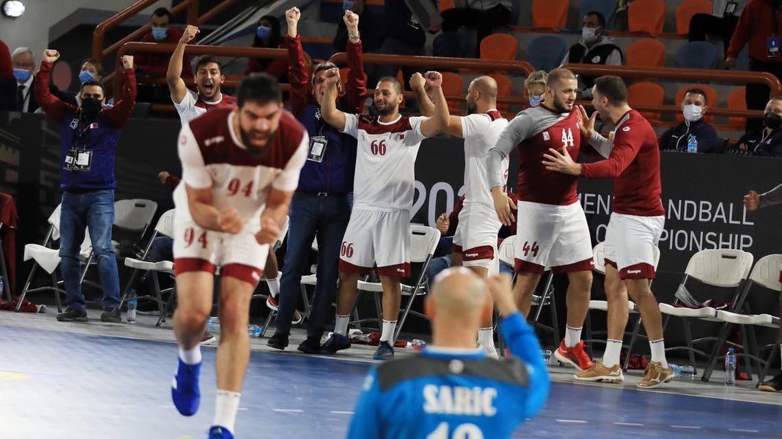Qatar's handball team celebrates their victory against Argentina, securing a quarter-final place. (Qatar Handball via Twitter)