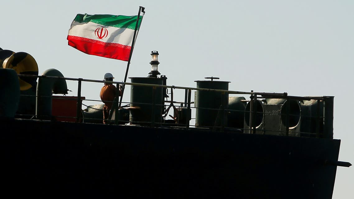 A crew member raises the Iranian flag on Iranian oil tanker Adrian Darya 1 in the Strait of Gibraltar, Spain, August 18, 2019. (Reuters)