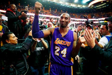 Kobe Bryant acknowledges the crowd as he leaves the court after their 112-104 win over the Boston Celtics in his final regular season NBA basketball game in Boston Wednesday, Dec. 30, 2015. (AP)