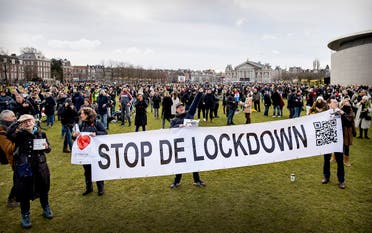 People gather at Amsterdam's Museumplein during a portest against the lockdown imposed to curb the spread of the Covid-19 pandemic and the outgoing government's policy, on January 21, 2021. (AFP)