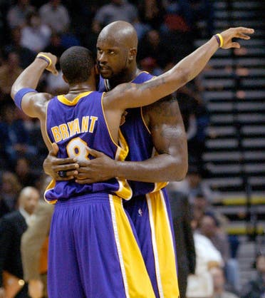 Kobe Bryant, left, and Shaquille O'Neal embrace after O'Neal set Bryant up for a score during the second half against the San Antonio Spurs on Thursday, Nov. 6, 2003. (AP)