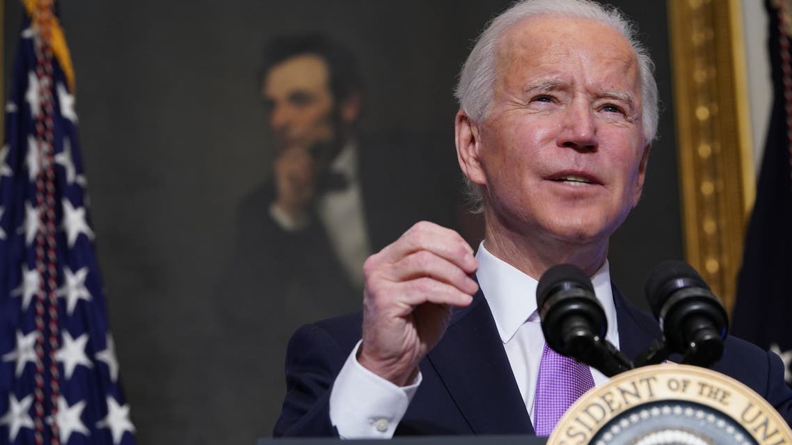 A painting of Abraham Lincoln is seen as US President Joe Biden speaks on Covid-19 response in the State Dining Room of the White House in Washington, DC on January 26, 2021. (AFP)