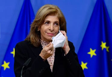 European Union commissioner for Health, Stella Kyriakides removes her protective face mask as she gives a press statement on vaccine deliveries at the EU headquarters in Brussels on January 25, 2021. (AFP)