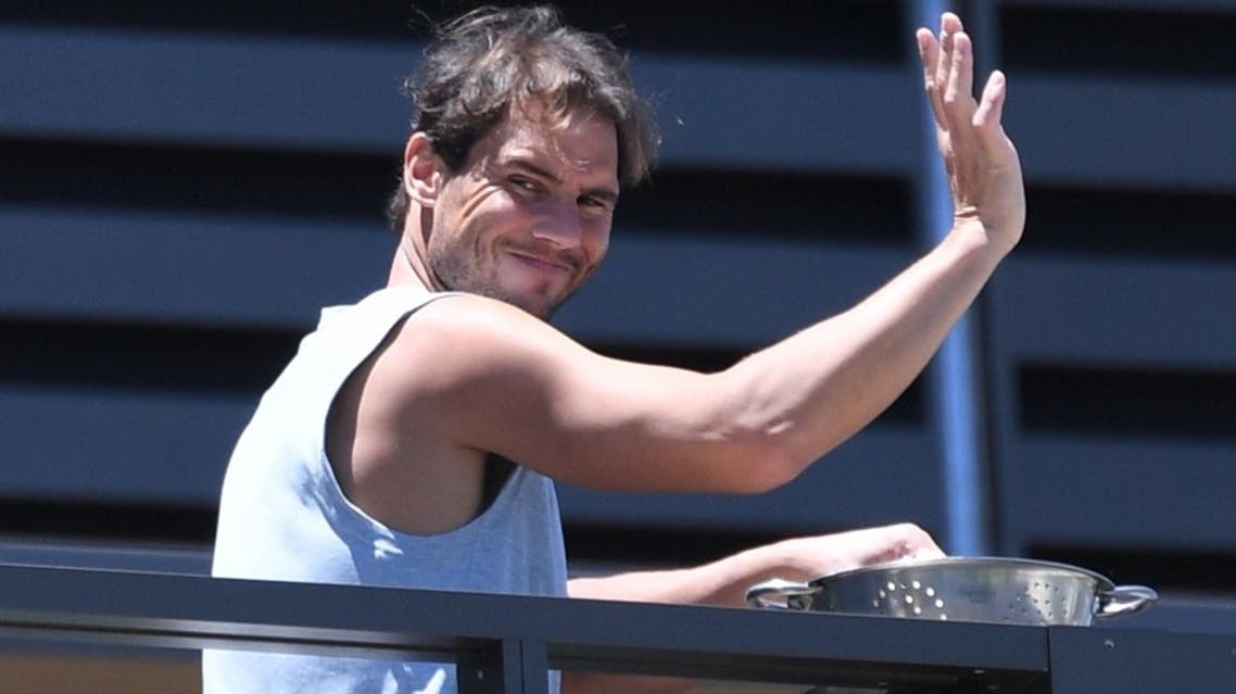  Rafael Nadal is seen waving from his balcony on January 23, 2021 at the accommodation in North Adelaide, where tennis players are undergoing mandatory quarantine ahead of the Australian Open. (Reuters)