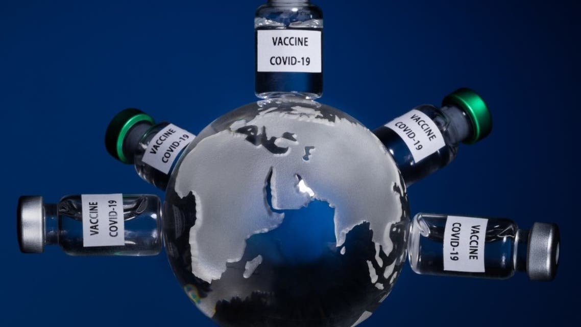 This picture taken on January 11, 2021 shows the globe with vaccine vials reading Covid-19 vaccine in Paris. (AFP)