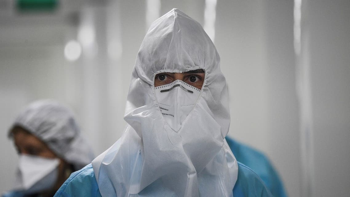 A healthcare worker with protection gear stands at the Covid-19 emergency room of Santa Maria hospital in Lisbon. (AP)