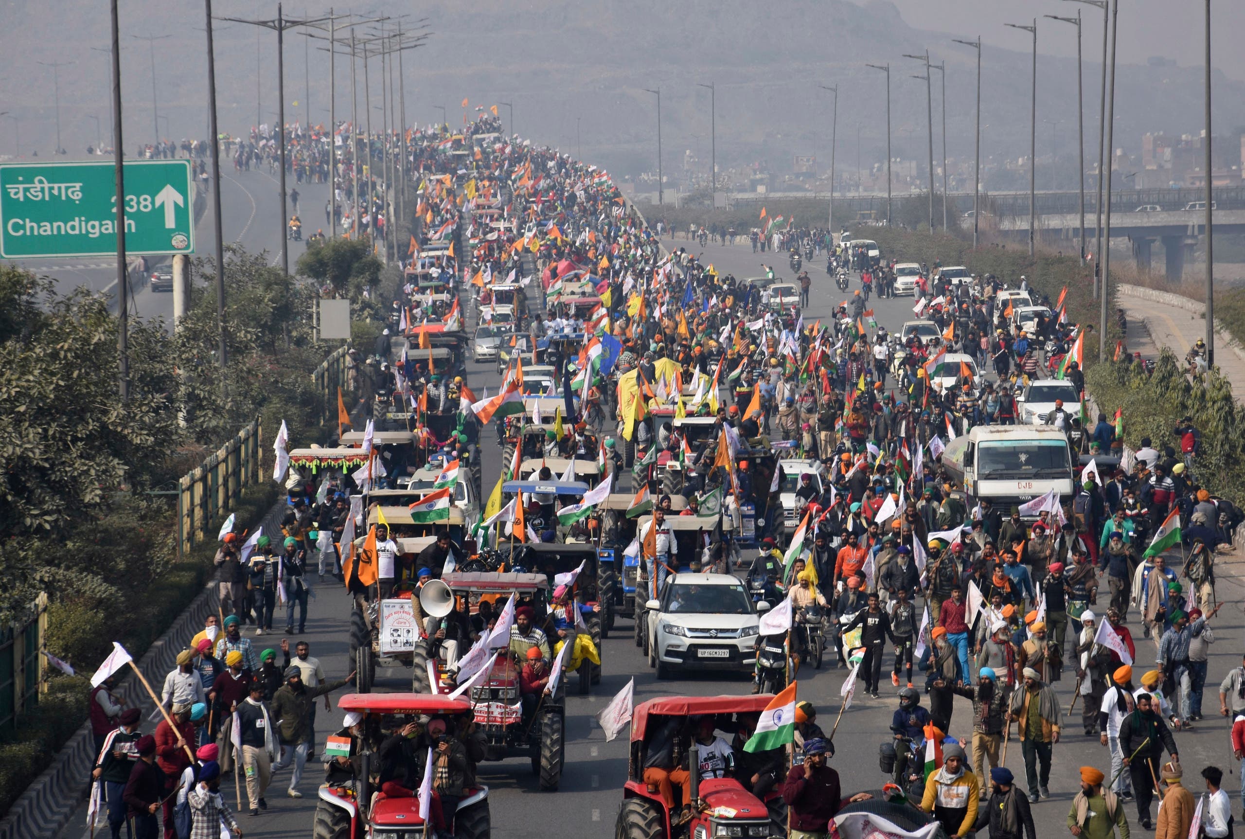 Farmers participate in a protest march towards the capital during India's Republic Day celebrations in New Delhi, India, Tuesday, Jan. 26, 2021. (AP)