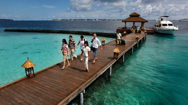 In this Feb. 12, 2012 file photo, foreign tourists arrive in a resort in the Kurumba island in Maldives. AP