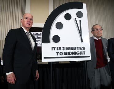 A file photo shows former California Governor Jerry Brown, (L) and former US Secretary of Defense William Perry unveil the Doomsday Clock during The Bulletin of the Atomic Scientists news conference, January 24, 2019 in Washington, DC. (AFP)