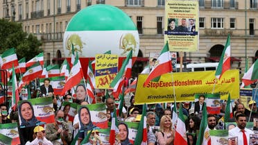 Iranian opposition supporters gather to protest against the death penalty in Iran, in Berlin, Germany, July 17, 2020. (Reuters)