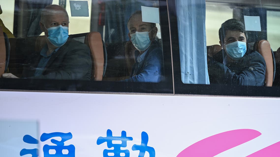 Peter Ben Embarek (top R), one of the members of the World Health Organization (WHO) team investigating the origins of the Covid-19 coronavirus pandemic, waves as he leaves the Jade Hotel after completing quarantine in Wuhan, China’s central Hubei province on January 28, 2021. 