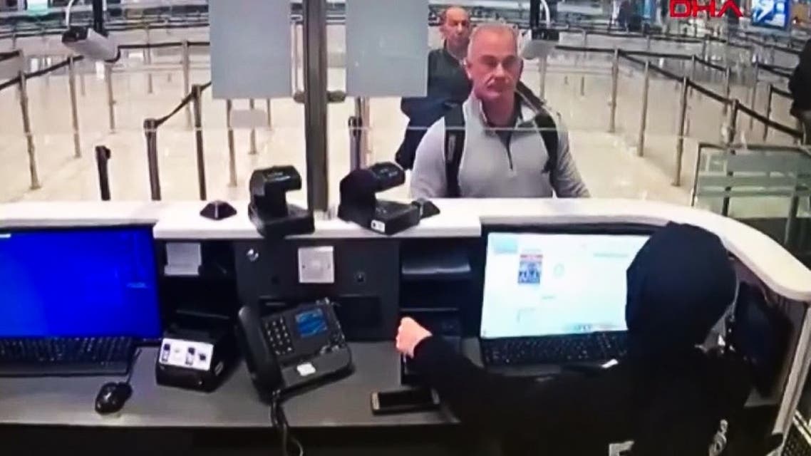 Michael Taylor (2R) and George Antoine Zayek (C) at passport control in Istanbul Airport, are two men accused of helping Carlos Ghosn escape via an Istanbul airport, Jan. 17, 2020. (AFP)
